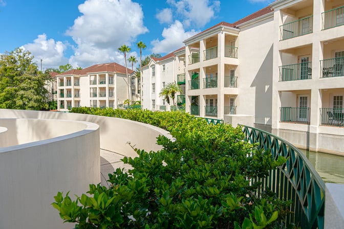 curved landscape beds in front of resort