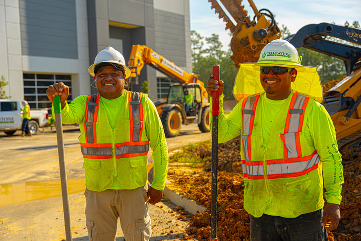 two men in construction smiling | Landscape Construction jobs Yellowstone Landscape