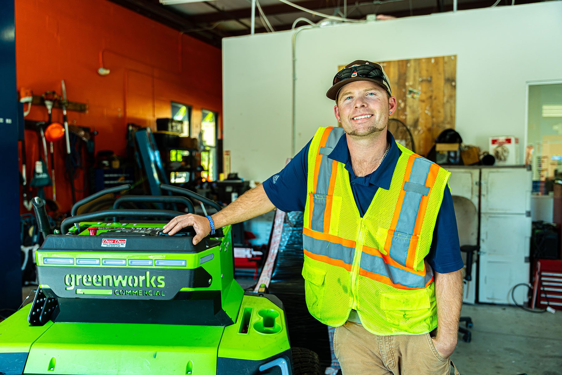 A Landscaper in front of a mower