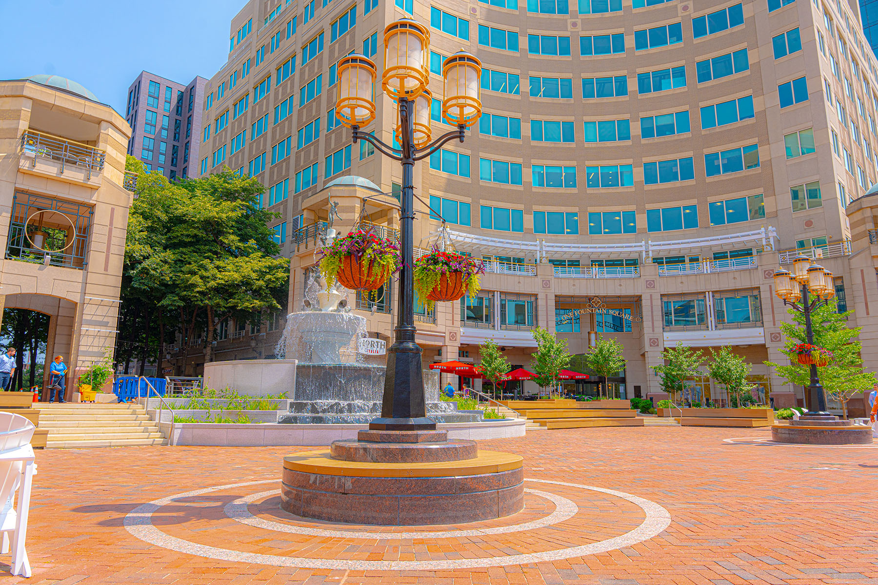 flower containers around lamp | Commercial Landscaping 