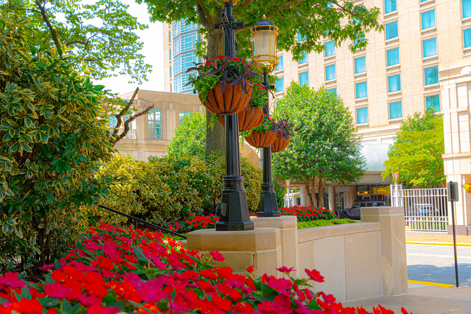 Flower beds and hanging flower containers | commercial landscaping example