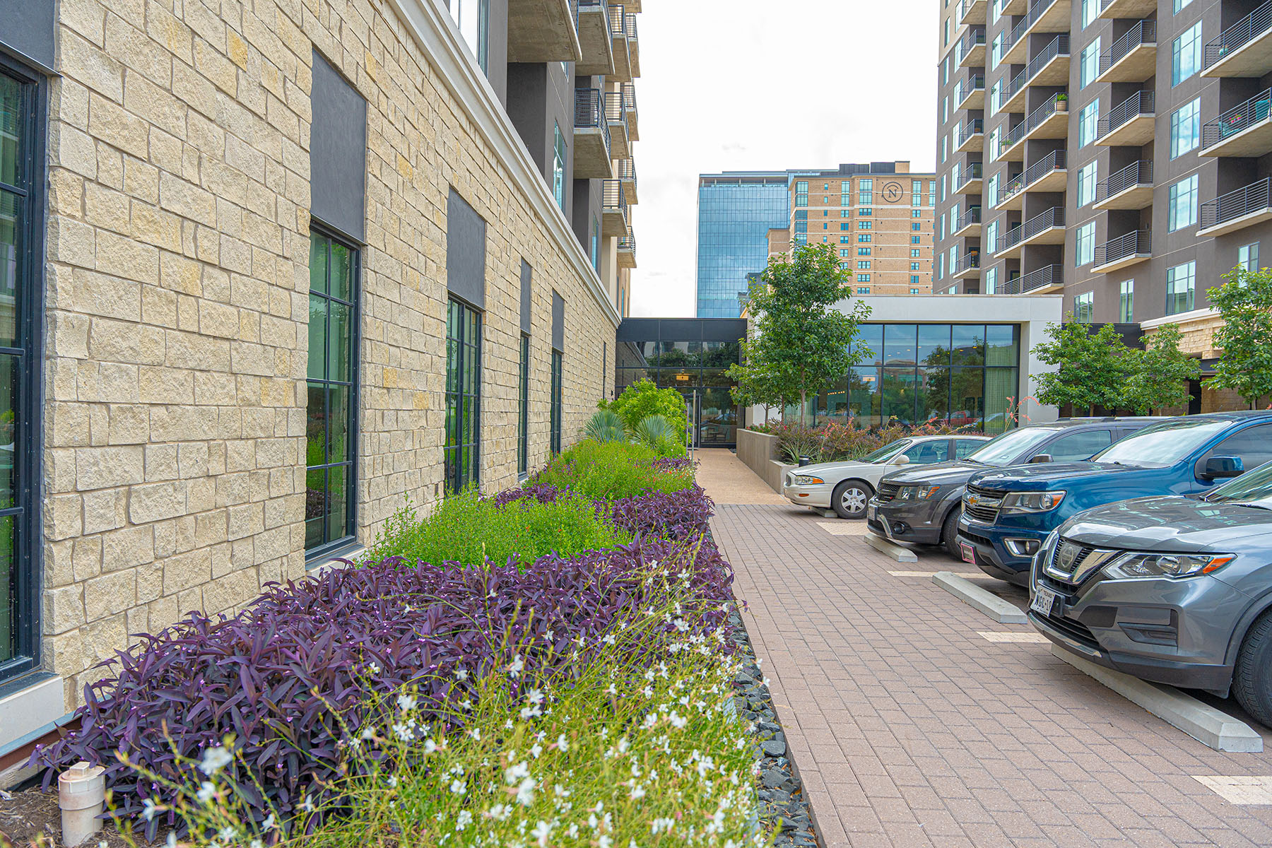 garden along pathway of building. example of commercial landscaping | Yellowstone Landscape