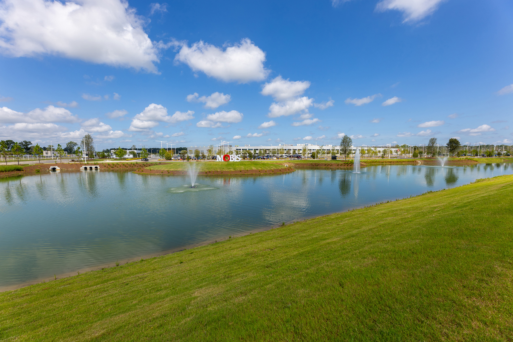 green turf around small pond | ex of commercial landscaping | yellowstone landscape 