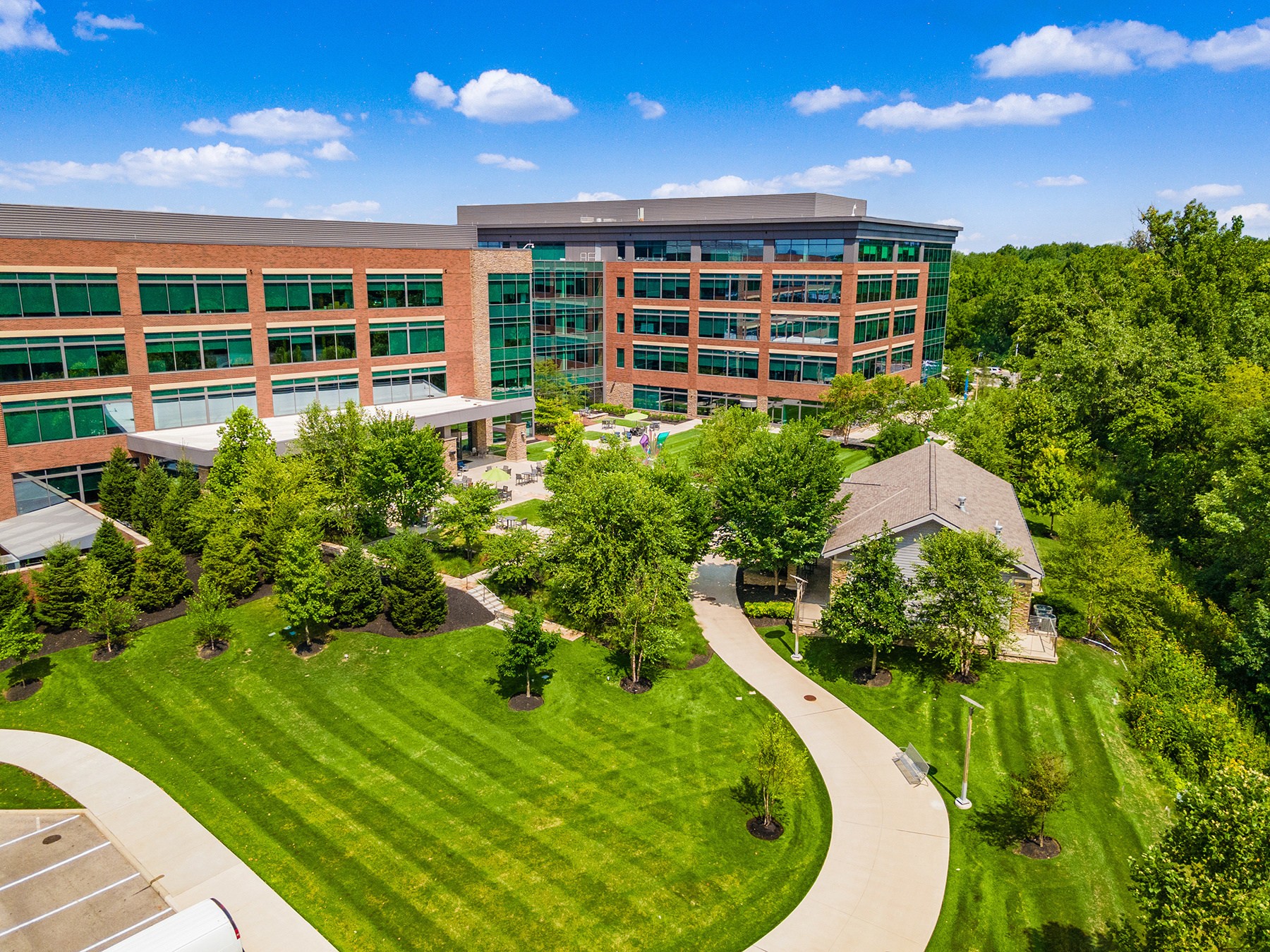 Green turf and trees in front of office. Commercial Landscaping Company in Ohio 