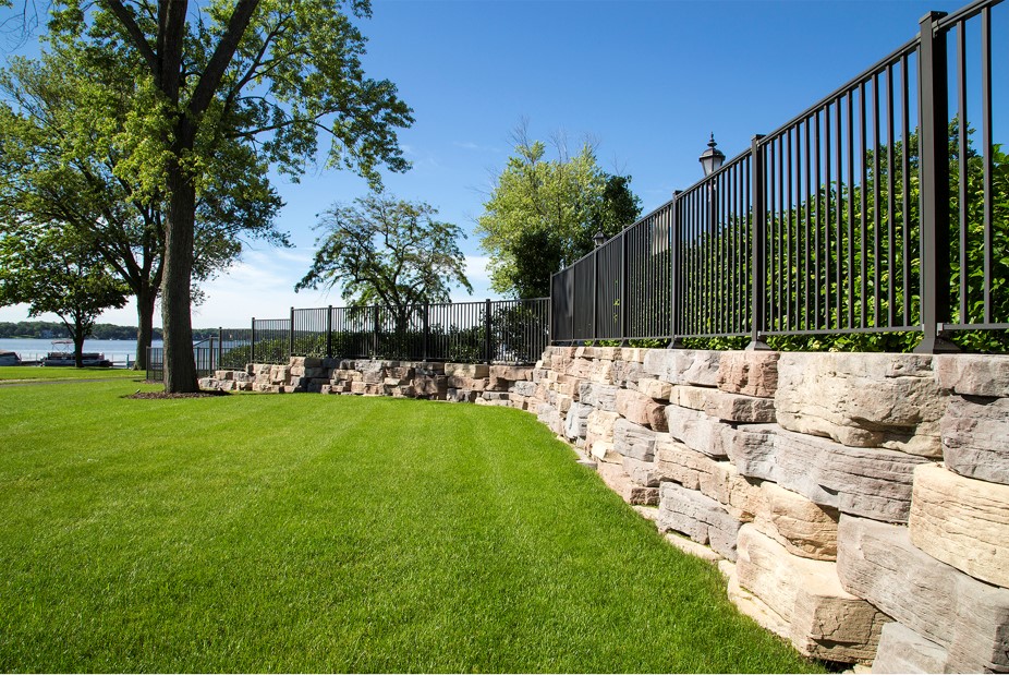 Green lawn and retaining wall