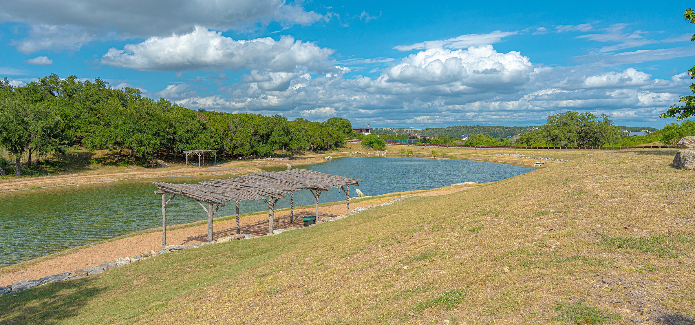 summer drought stress landscape with lake at low water level