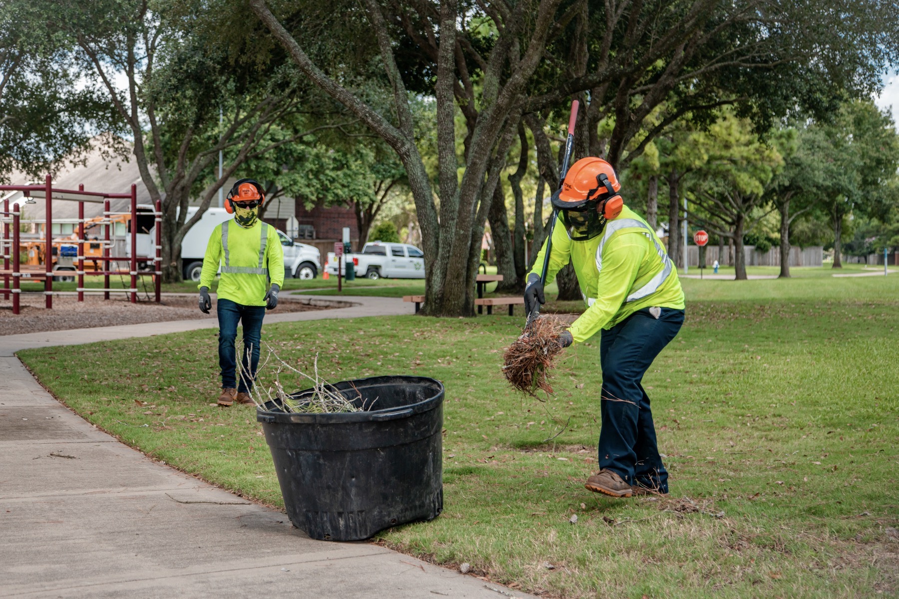 Maintenance crews cleaning up leaf and tree debris